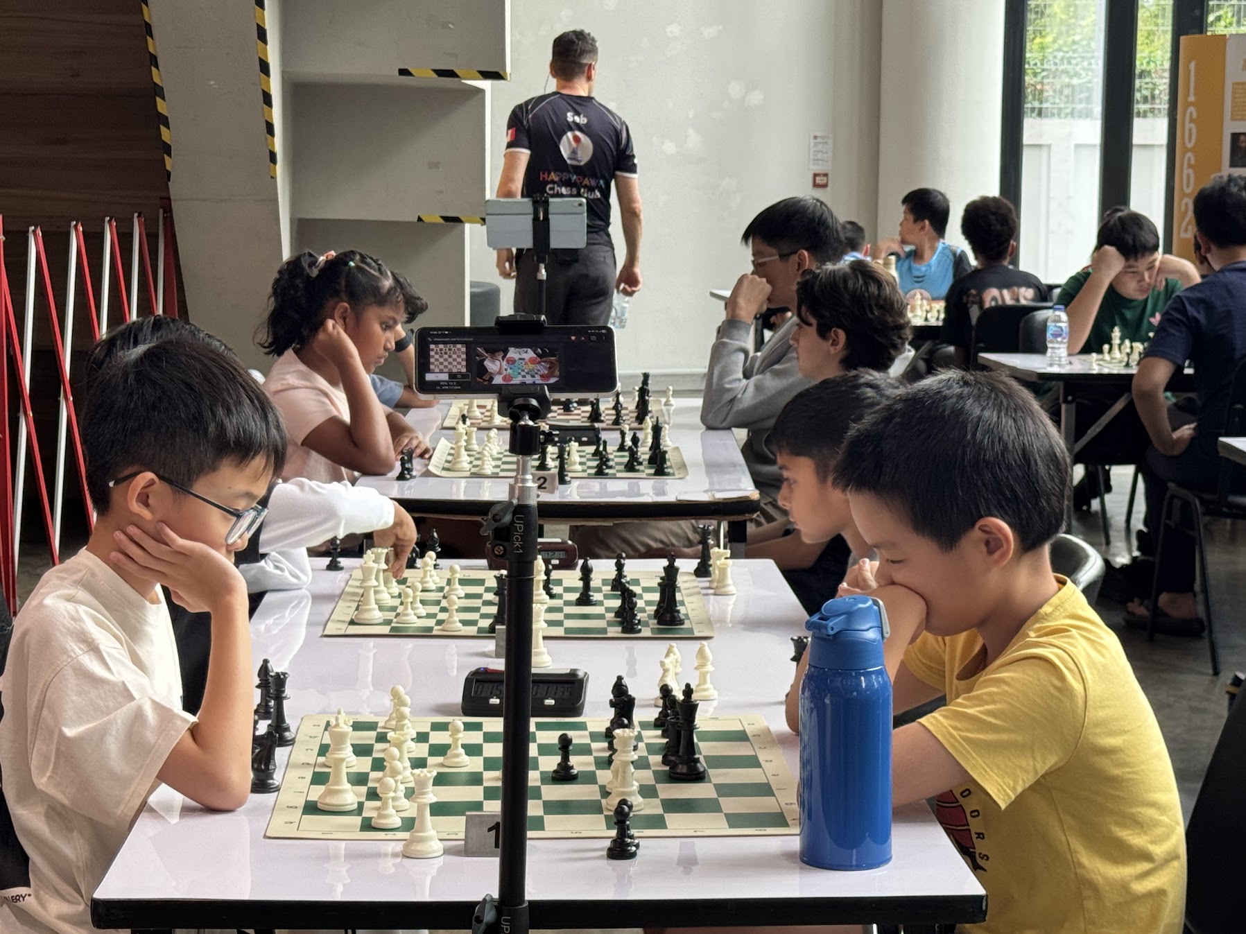 Kids playing chess games at the tournament